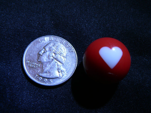 Heart Globe next to quarter