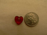 little heart bead next to a quarter