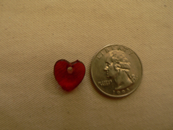 little heart bead next to a quarter
